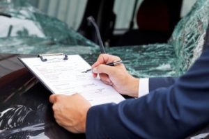 Man filling out a truck accident claim