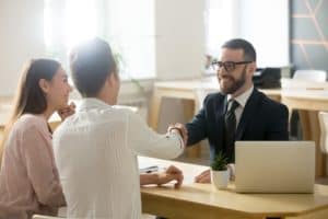 a Dothan, AL bad faith insurance lawyer meets with a family about their claim