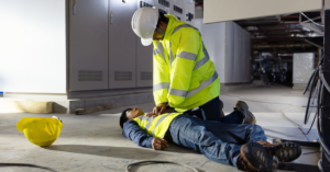 Electrician giving CPR to work partner