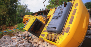 The backhoe is overturning at the construction site.