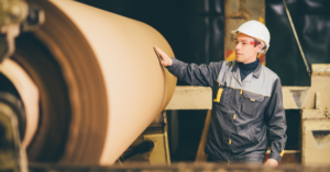 Worker at paper making factory