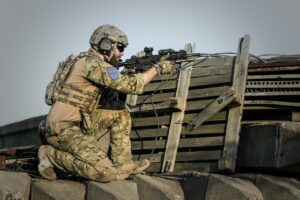 A soldier aiming his gun